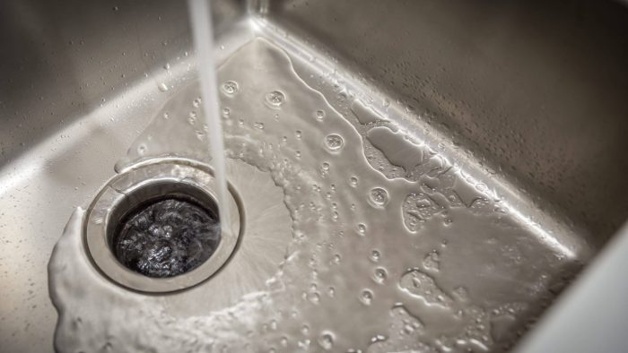 Stainless Kitchen Sink With Food Waste Disposal In Modern Home